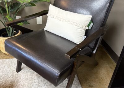 mid century brown leather accent chair with wood arms image