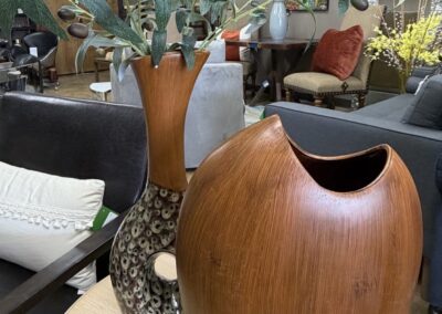 two brown vases with olive branches image