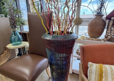 Very large multi-colored glazed vase with colored sticks image