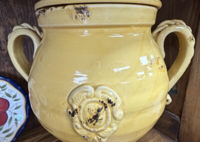 Yellow glazed pottery canister with handles image