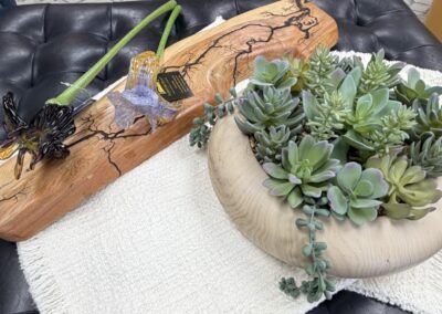blown glass flowers with a bowl of succulents image