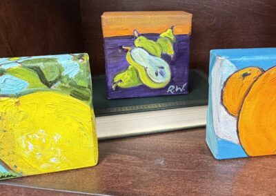 three oil on canvas square paintings of fruit image