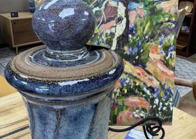 Artwork of Tree next to a blue pottery canister image