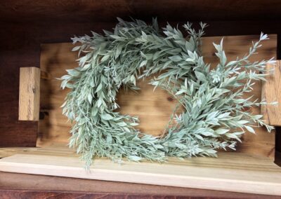 Faux foliage wreath with two cutting boards image