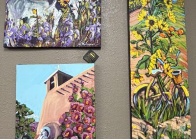 Three oil on canvas paintings, a donkey, a bicycle with sunflowers, a church image