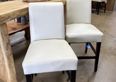 Bar height white leather chairs